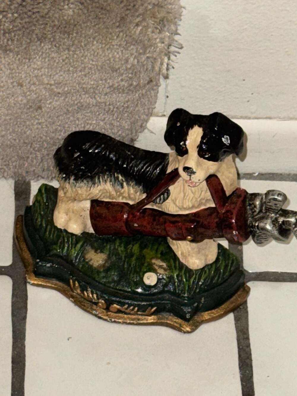 vintage cast iron doorstop or fireplace dog, black & white landseer w/ golf club